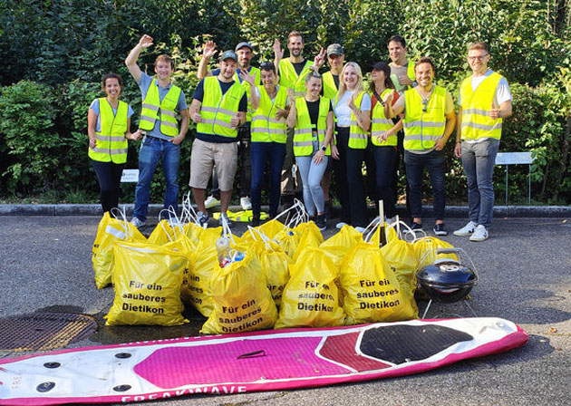 The bb trading team on Clean-Up Day with bags of collected waste.