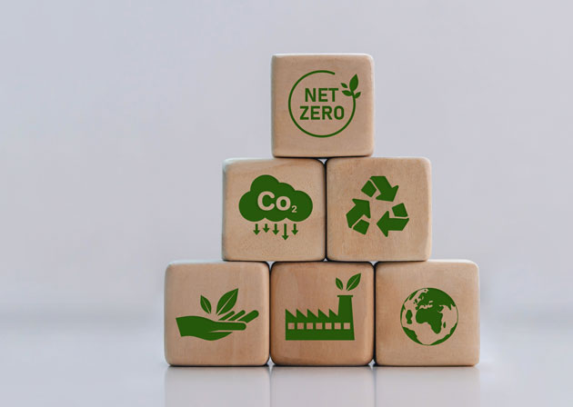 Net Zero Carbon neutral and net zero concept green net center icon on wooden block Natural environment, weather, with a rotating globe with plasticine. Greenhouse gas emissions target stock photo